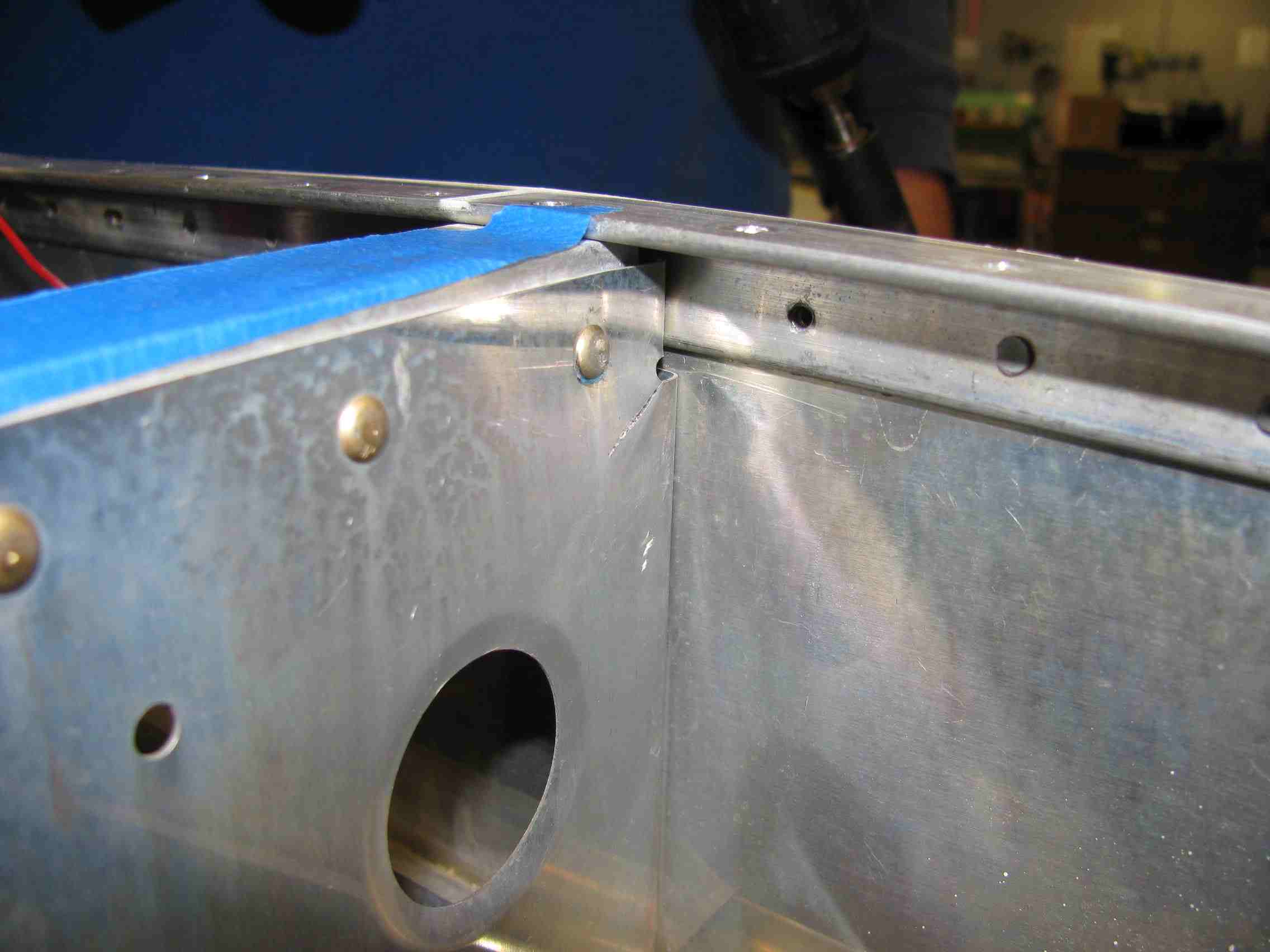 4_Crack_after_centerpunching_rivet_for_drilling.jpg