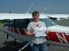 Cristal holding Pilot certificate by training plane.jpg